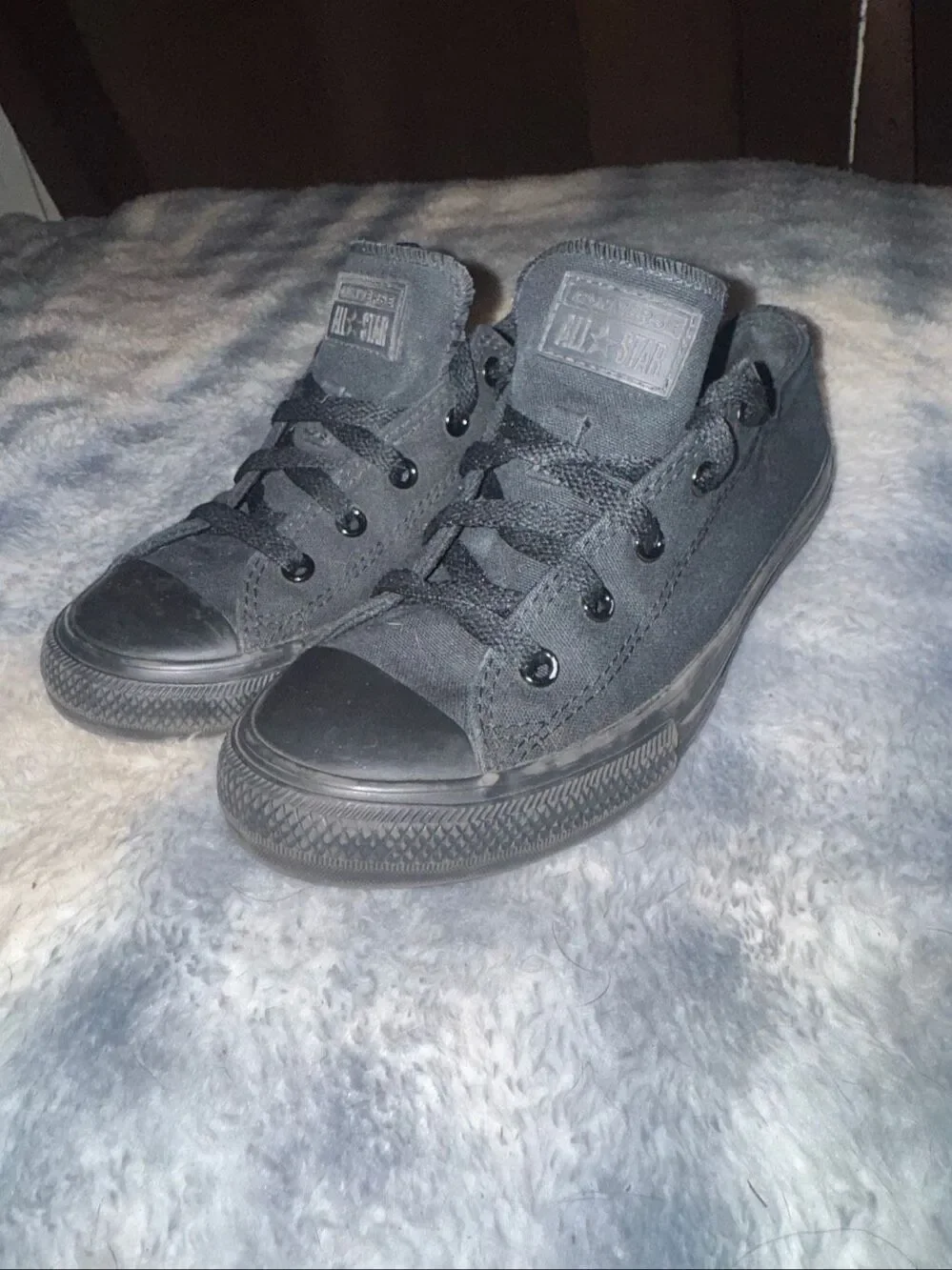 All black low top Converses size youth 3